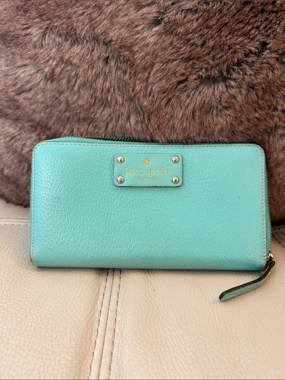kate spade aqua zip-around leather wallet with gold logo plate